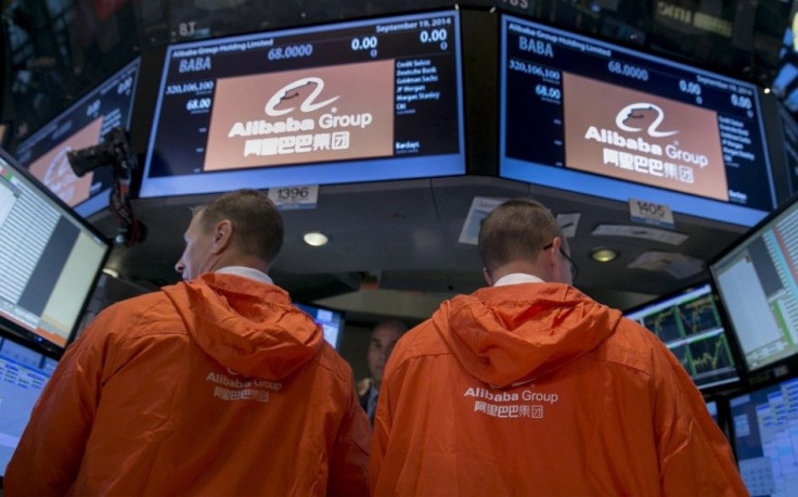 Specialist traders work at the post that trades Alibaba Group Holding Ltd during the company's initial public offering (IPO) under the ticker &quot;BABA&quot; at the New York Stock Exchange in New York September 19, 2014.