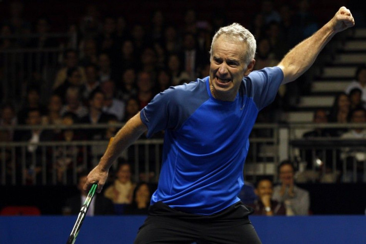 John McEnroe of the U.S. reacts after winning a point during his BNP Paribas Showdown friendly tennis match against compatriot Ivan Lendl in Hong Kong March 4, 2013. REUTERS/Tyrone Siu