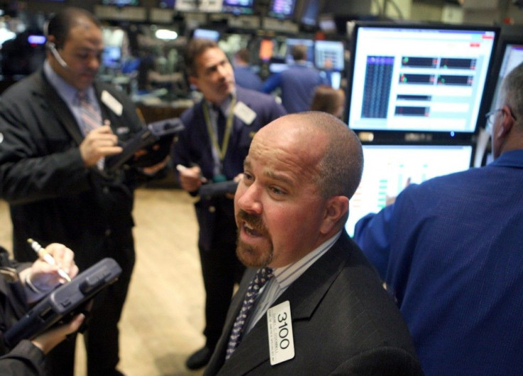 Traders work on the floor of the New York Stock Exchange, December 11, 2008.