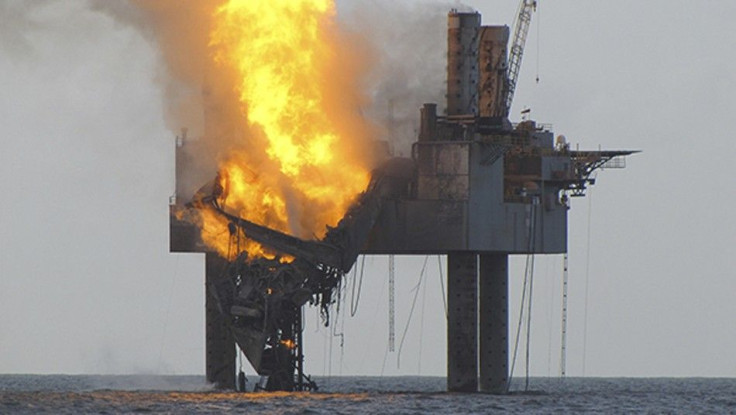 Hercules 265 rig fire that has caused collapse of the drill floor and derrick after a July 23, 2013 night explosion is shown in this U.S. Coast Guard photo released by the Bureau of Safety and Environmental Enforcement (BSEE) on July 24, 2013.