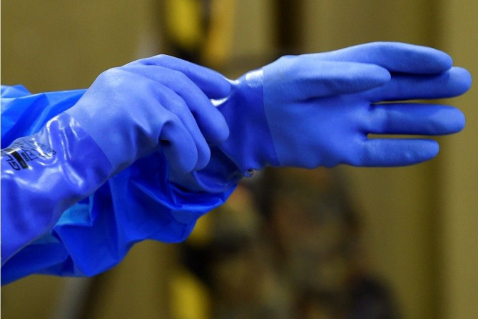 Rubber gloves are pictured in a dressing area during an Ebola training session of German army Bundeswehr