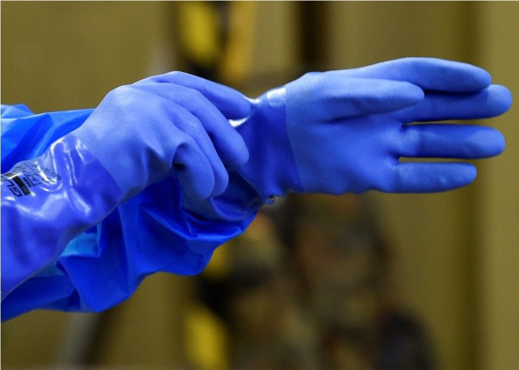 Rubber gloves are pictured in a dressing area during an Ebola training session of German army Bundeswehr