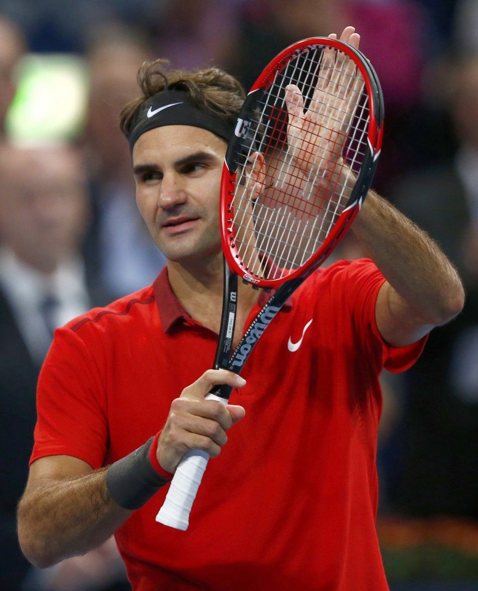 Roger Federer of Switzerland celebrates after defeating Denis Istomin of Uzbekistan at the Swiss Indoors ATP tennis tournament in Basel October 23, 2014. REUTERSArnd Wiegmann