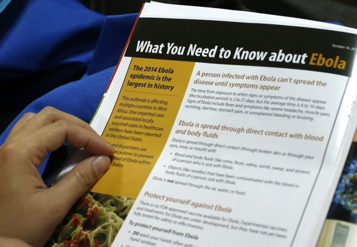 A woman reads a pamphlet as New York Healthcare workers attend an Ebola educational session at the Jacob Javits Convention center in New York, October 21, 2014. Thousands of healthcare workers representing dozens of clinical and non-clinical positions att