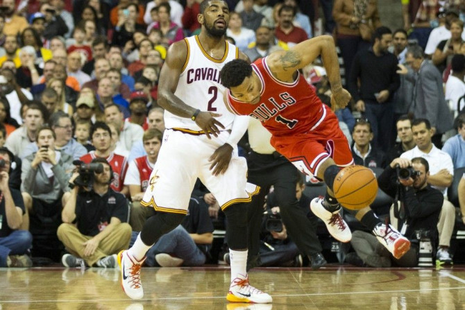 Oct 20, 2014; Columbus, OH, USA; Chicago Bulls guard Derrick Rose (1) is fouled by Cleveland Cavaliers guard Kyrie Irving (2) at Value City Arena.