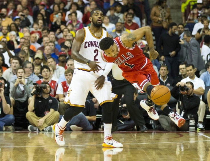 Oct 20, 2014; Columbus, OH, USA; Chicago Bulls guard Derrick Rose (1) is fouled by Cleveland Cavaliers guard Kyrie Irving (2) at Value City Arena.