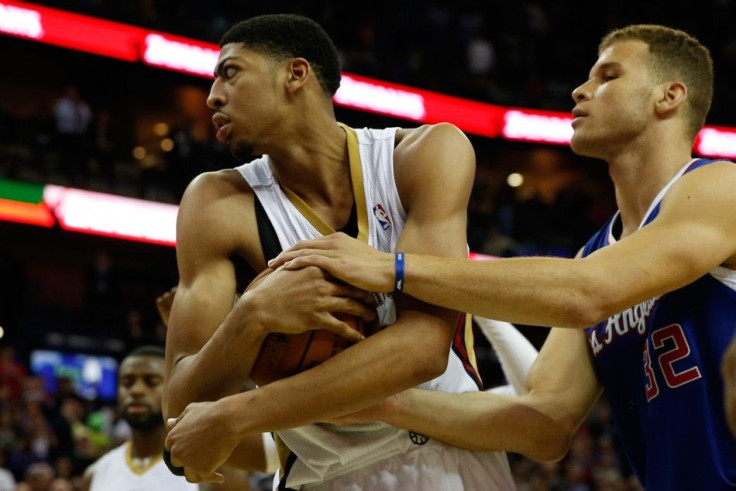 Mar 26, 2014; New Orleans, LA, USA; New Orleans Pelicans forward Anthony Davis (23) is fouled by Los Angeles Clippers forward Blake Griffin (32) after securing a rebound following a free throw attempt during the fourth quarter of a game at the Smoothie Ki