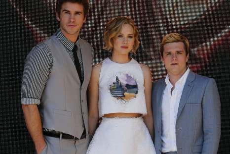 (Left To Right) Cast Members Liam Hemsworth, Jennifer Lawrence And Josh Hutcherson Pose During A Photocall for The film 'The Hunger Games : Mockingjay - Part 1'