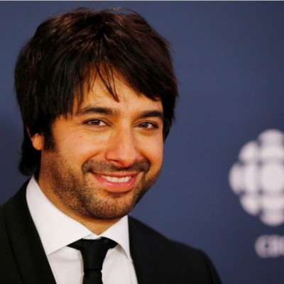 CBC personality Jian Ghomeshi arrives on the red carpet at the 2014 Canadian Screen awards