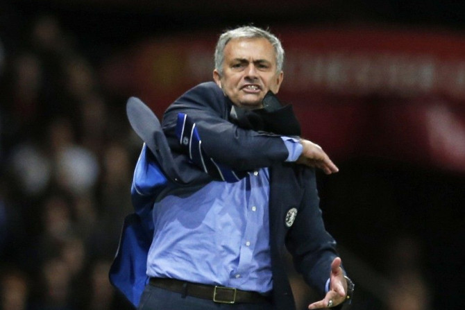 Chelsea's manager Jose Mourinho reacts during their English Premier League soccer match against Manchester United at Old Trafford in Manchester, northern England October 26, 2014.