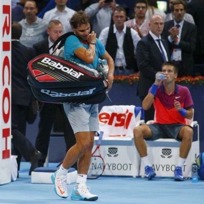 Spain's Rafael Nadal (front L) leaves after losing his match against Borna Coric (R) of Croatia at the Swiss Indoors ATP tennis tournament in Basel October 24, 2014. REUTERS/Arnd Wiegmann