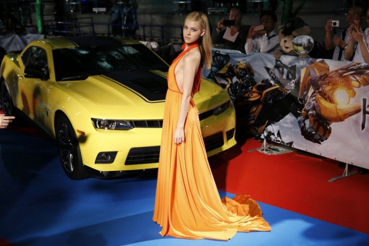 Cast member Nicola Peltz poses for photos during the Japan premiere of the movie &quot;Transformers: Age of Extinction&quot; in Tokyo July 28, 2014. The movie will open in Japan on August 8, 2014.