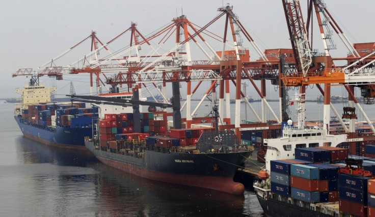 Cargo vessels docked at Manila&#039;s main port wait to unload containers, August 20, 2014. Cargoes are being held up by severe congestion at Manila&#039;s main port, where containers have piled up since February when a daytime ban on trucks plying the ci