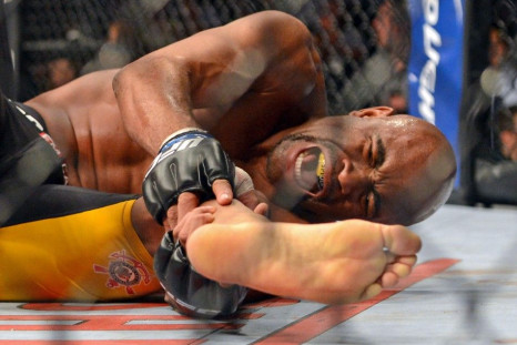 Dec 28, 2013; Las Vegas, NV, USA; Anderson Silva reacts after breaking his leg on a kick to Chris Weidman (not pictured) during their UFC middleweight championship bout at the MGM Grand Garden Arena.