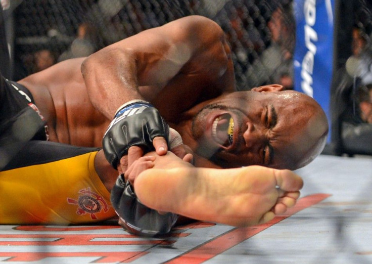 Dec 28, 2013; Las Vegas, NV, USA; Anderson Silva reacts after breaking his leg on a kick to Chris Weidman (not pictured) during their UFC middleweight championship bout at the MGM Grand Garden Arena.