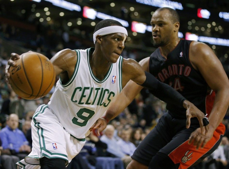 Mar 26, 2014; Boston, MA, USA; Boston Celtics guard Rajon Rondo (9) drives the ball against Toronto Raptors forward Chuck Hayes (44) in the second half at TD Garden. Toronto defeated Boston 99-90.