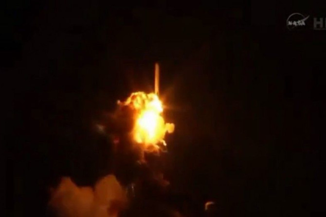 An unmanned Antares rocket is seen exploding seconds after lift off