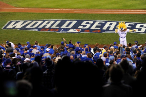 Oct 28, 2014; Kansas City, MO, USA; Kansas City Royals mascot performs on top of the dugout in the 7th inning against the San Francisco Giants during game six of the 2014 World Series at Kauffman Stadium.