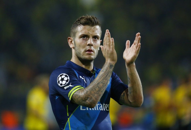 Arsenal's Jack Wilshere applauds the fans after their Champions League group D soccer match against Borussia Dortmund in Dortmund September 16, 2014.