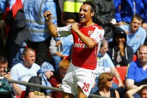 Arsenal's Santi Cazorla celebrates after scoring the opening goal during their English Community Shield soccer match against Manchester City at Wembley Stadium in London, August 10, 2014.