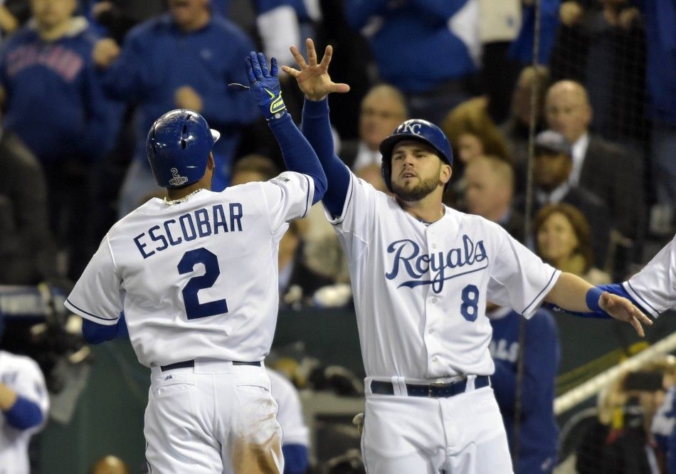 Kansas City Royals shortstop Alcides Escobar celebrates with third baseman Mike Moustakas 