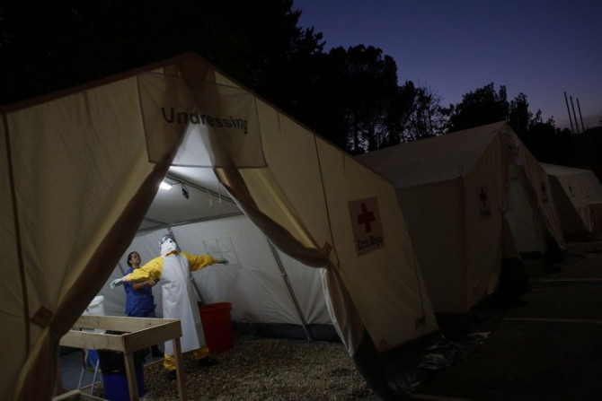A worker is decontaminated during an Ebola training session held by Spain&#039;s Red Cross in Madrid October 29, 2014. The Spanish Red Cross is training doctors, nurses and engineers to fight Ebola in Western Africa during a two day pre-deployment course 