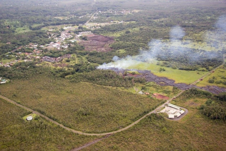 The flow of lava from the Kilauea Volcano is pictured near the village of Pahoa, Hawaii in this October 27, 2014 aerial handout photo. A slow-moving river of molten lava from an erupting volcano flowed through a residential property on Hawaiis Big Island