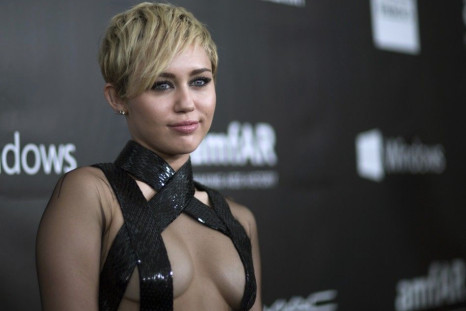 Singer Miley Cyrus poses at the amfAR's Fifth Annual Inspiration Gala in Los Angeles