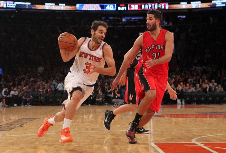 Oct 13, 2014; New York, NY, USA; New York Knicks point guard Jose Calderon (3) drives on Toronto Raptors point guard Greivis Vasquez (21) during the third quarter at Madison Square Garden.