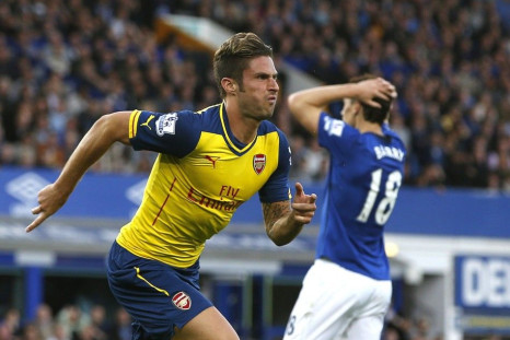 Arsenal's Olivier Giroud (L) celebrates after scoring a goal against Everton during their English Premier League soccer match at Goodison Park in Liverpool, northern England August 23, 2014.