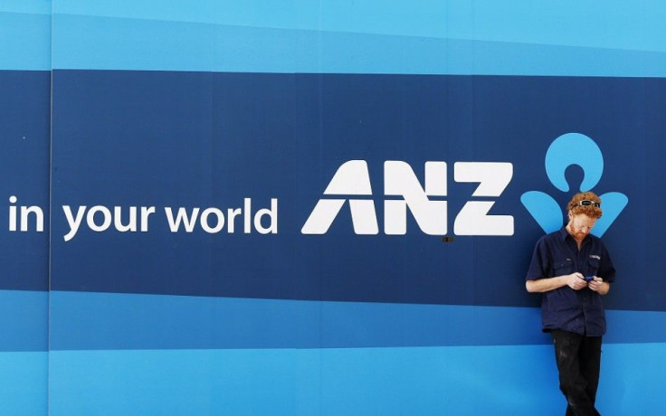 A man uses his mobile phone outside an Australia and New Zealand bank branch in central Sydney August 16, 2013. 