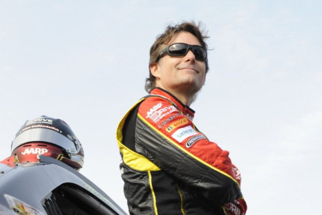 Jeff Gordon stands next to his number 24 Chevrolet before the start of the second NASCAR Sprint Cup Series Budweiser Duel at the Daytona International Speedway in Daytona Beach, Florida February 21, 2013. The two Duel races determine starting positions fo