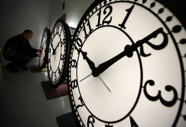 Peter Shugrue checks one of four custom, flush mounted clocks, destined for installation in Kansas City, Missouri, at the Electric Time Company factory in Medfield, Massachusetts March 8, 2013.