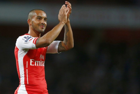 Arsenal's Theo Walcott applauds the fans after their English Premier League soccer match against Burnley at the Emirates Stadium in London November 1, 2014.
