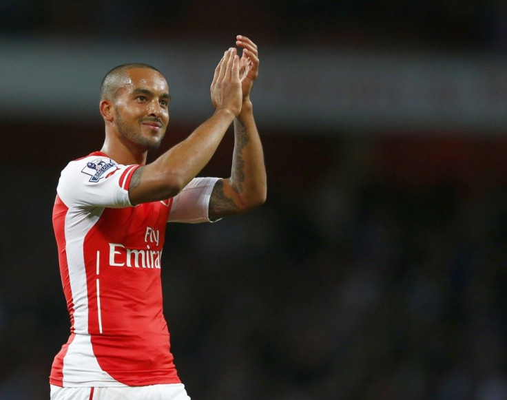 Arsenal's Theo Walcott applauds the fans after their English Premier League soccer match against Burnley at the Emirates Stadium in London November 1, 2014.