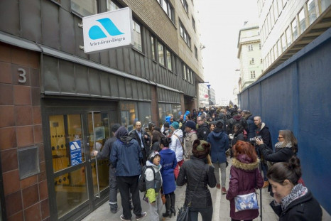 Job-seekers gather around an employment office in central Stockholm February 26, 2014. Police dispersed an angry crowd of job-seekers outside an employment office in Stockholm on Wednesday after it called 61,000 people for a recruitment meeting by mistake