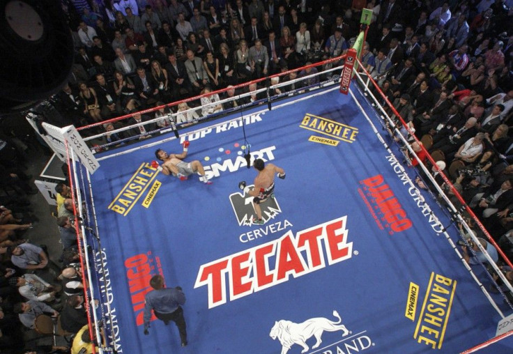 Manny Pacquiao of the Philippines is knocked down by Juan Manuel Marquez