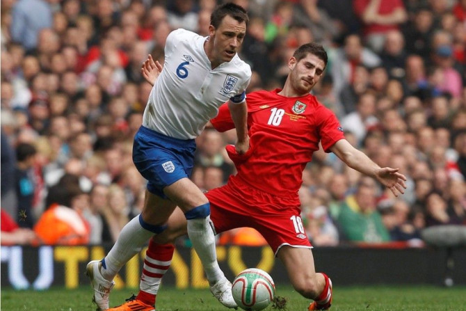 England&#039;s John Terry challenges Wales&#039; Ched Evans (R) during their Euro 2012 Group G qualifying soccer match
