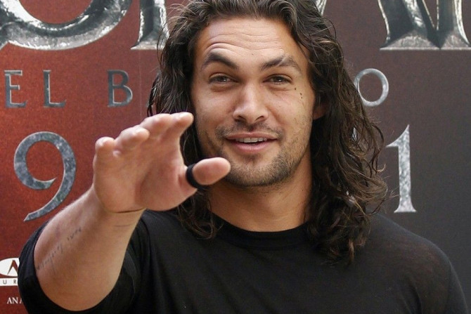 U.S. actor Jason Momoa poses for photographers during the presentation of the movie &quot;Conan the Barbarian&quot; in Madrid July 18, 2011.