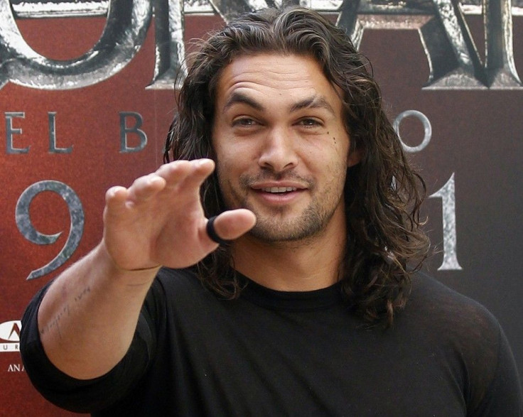 U.S. actor Jason Momoa poses for photographers during the presentation of the movie &quot;Conan the Barbarian&quot; in Madrid July 18, 2011.