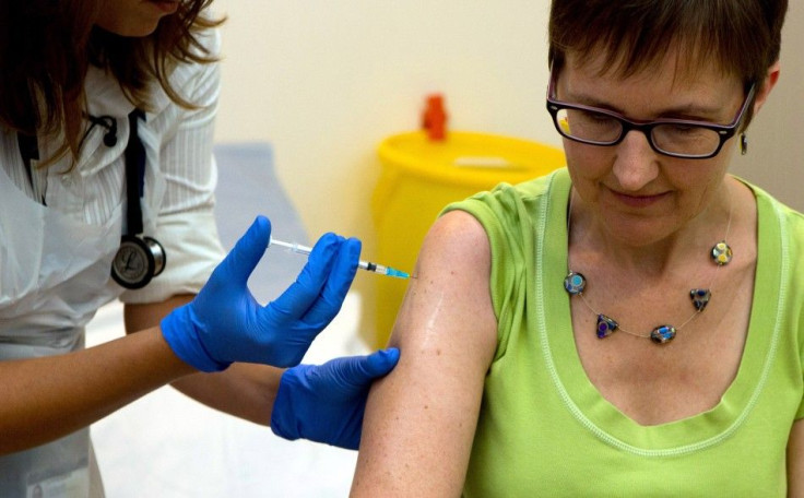 Volunteer Ruth Atkins receives an injection of the Ebola vaccine, at the Oxford Vaccine Group Centre for Clinical Vaccinology and Tropical Medicine (CCVTM) in Oxford, southern England September 17, 2014. The first volunteer in a fast-tracked British safet