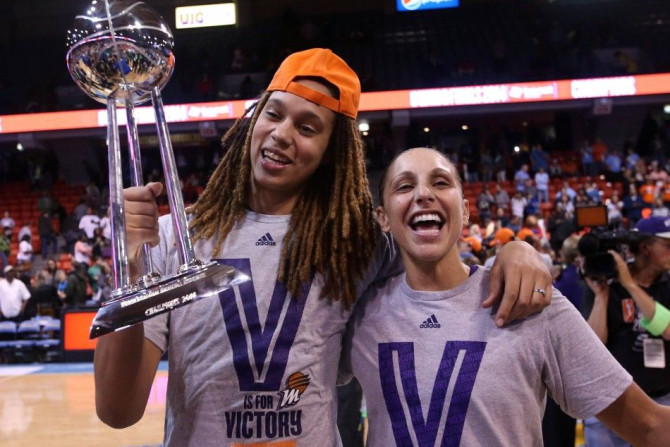 Sep 12, 2014; Chicago, IL, USA; Phoenix Mercury center Brittney Griner (left) and guard Diana Taurasi (right) celebrate with the WNBA championship trophy after defeating the Chicago Sky 87-82 in game three of the 2014 WNBA Finals at UIC Pavilion.