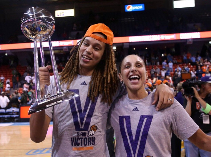 Sep 12, 2014; Chicago, IL, USA; Phoenix Mercury center Brittney Griner (left) and guard Diana Taurasi (right) celebrate with the WNBA championship trophy after defeating the Chicago Sky 87-82 in game three of the 2014 WNBA Finals at UIC Pavilion.