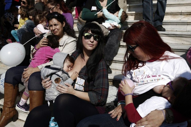 Women breastfeed babies during a mass event in Athens November 2, 2014. Hundreds of women gathered and fed babies in public to raise awareness among young mothers on the practice at the beginning of the annual World Breastfeeding Week.