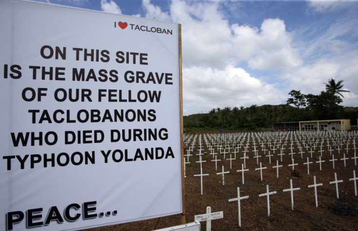 A sign and wooden crosses are placed for victims of Typhoon Haiyan at a mass grave in Tacloban city in central Philippines November 5, 2014. The Philippines are preparing to commemorate victims of Typhoon Haiyan, ahead of the one-year anniversary of the d