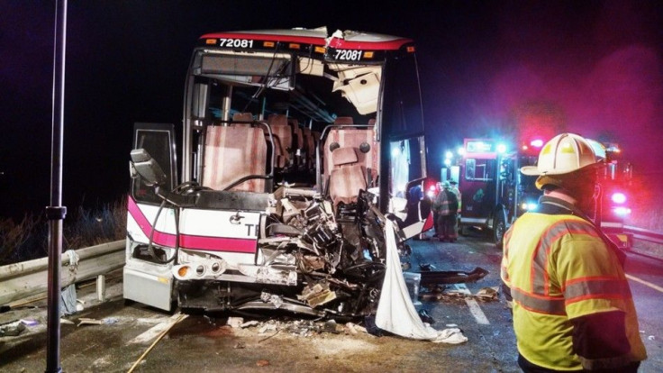 Emergency personnel attend to the scene of a bus accident in this handout photo