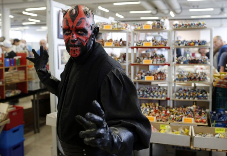 A visitor dressed as a Star Wars character poses at the cartoon fair "Vienna Comix"