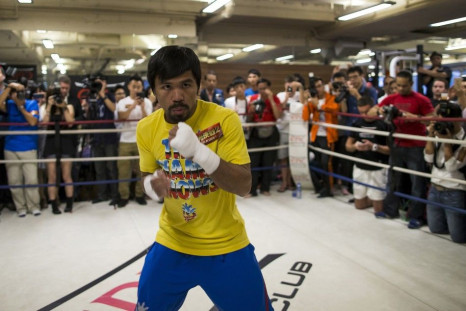 Boxer Manny Pacquiao of the Philippines trains during a media workout in Hong Kong October 27, 2014. Pacquiao is on tour ahead of defending his WBO World Welterweight title on November 23 against Chris Algieri of the U.S. at the Venetian's Cotai Aren
