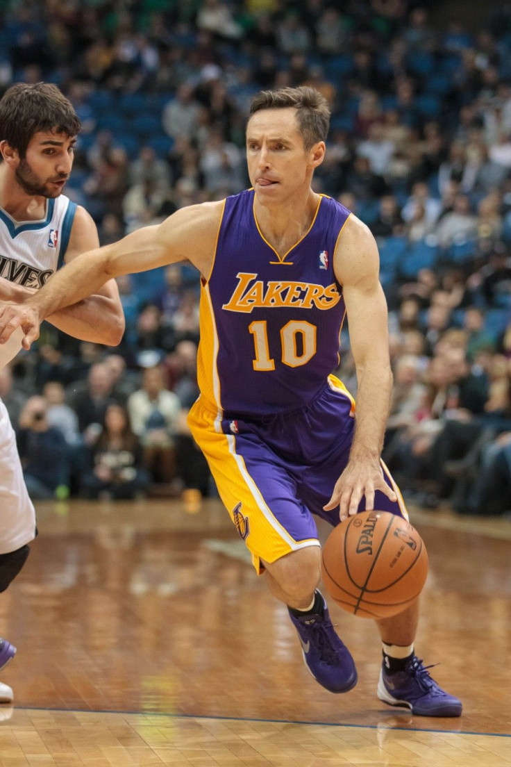 Los Angeles Lakers guard Steve Nash (10) dribbles in the first quarter against the Minnesota Timberwolves at Target Center.