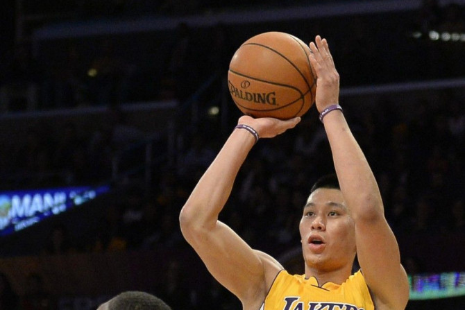 Los Angeles Lakers guard Jeremy Lin (17) shoots the basketball against Phoenix Suns guard Eric Bledsoe (2) during the second half at Staples Center.